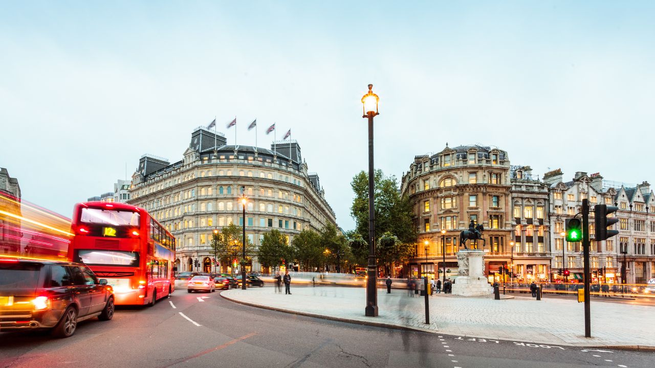 a road with buses and traffic in london